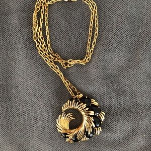 Juicy Couture long gold chain with large charm.